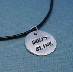 Doctor Who Inspired -  Don't Blink - A Hand Stamped Aluminum Disc Necklace
